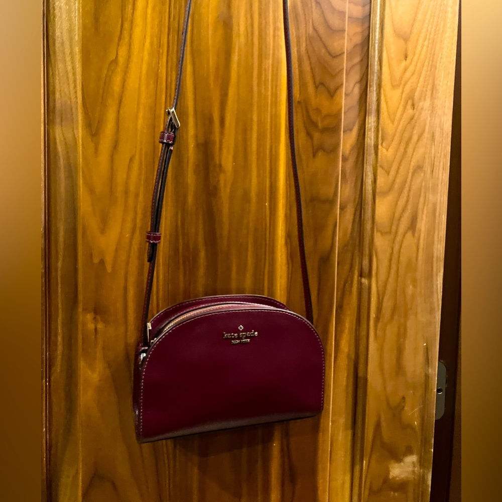 Used once adorable kate spade cherrywood small dome leather crossbody purse.